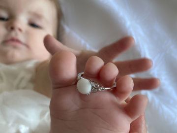 Baby Laying Down With Breast Milk Ring Around Toes - KeepsakeMom