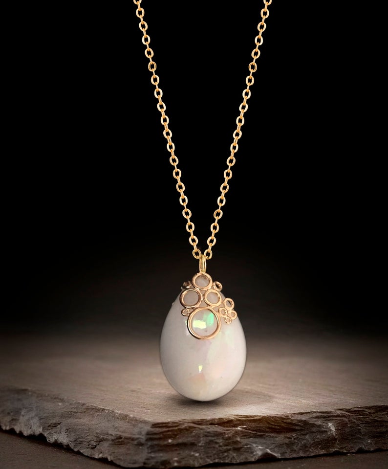 Breastmilk jewelry necklace pendant drop teardrop shape with opal effect flakes and fancy bail from KeepsakeMom gold chain and bail