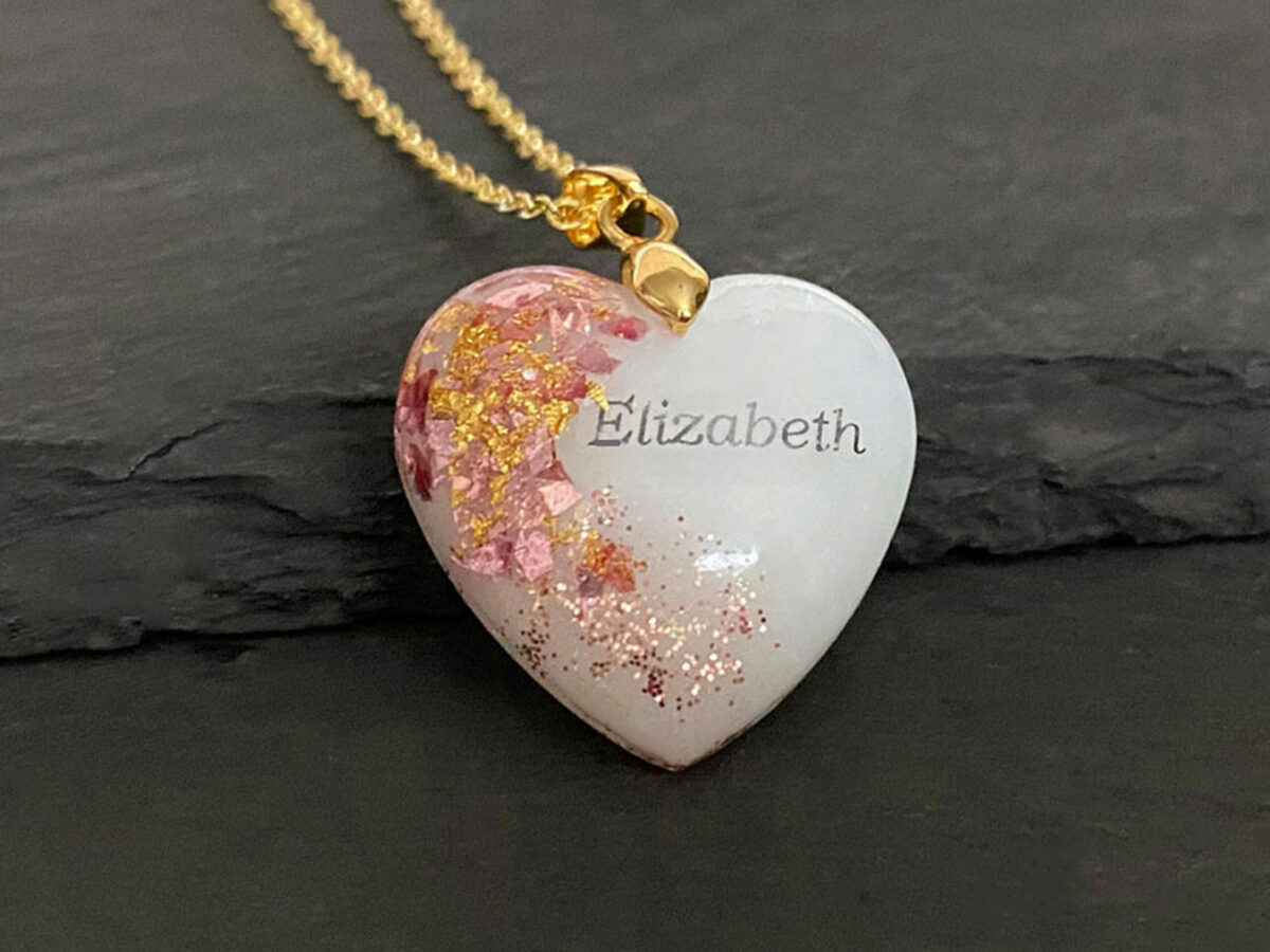 Breastmilk jewelry heart necklace with baby girl pink and yellow gold flakes, chain and bail and baby name KeepsakeMom