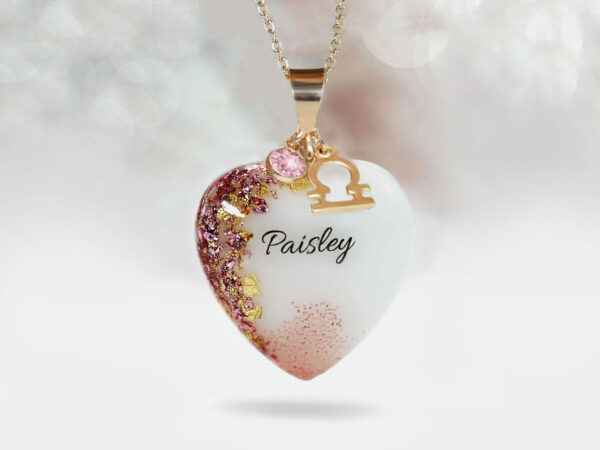 breast milk jewelry heart necklace with yellow gold and baby girl pink flakes and baby's name and pink baby charm with zodiac charm from keepsakemom