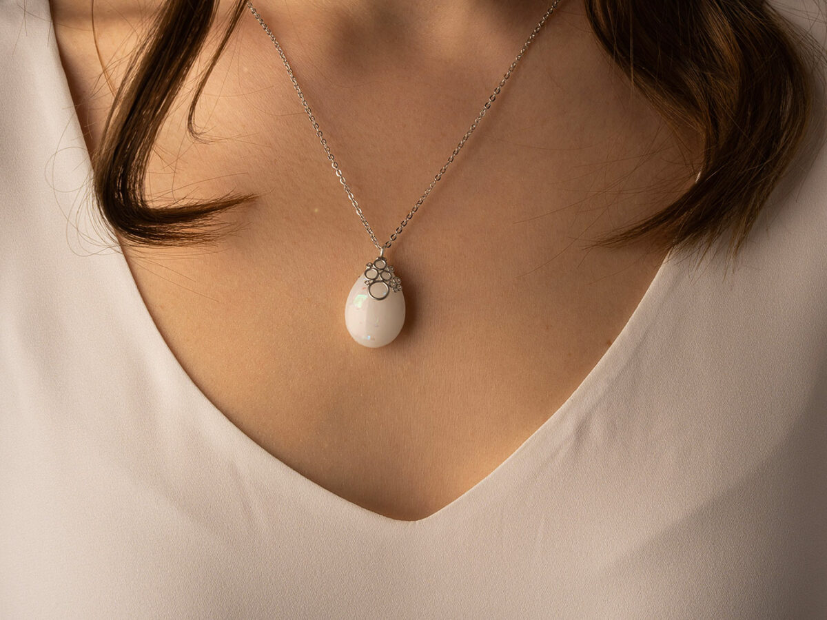 Breastmilk jewelry necklace pendant drop teardrop shape with opal effect flakes and fancy bail from KeepsakeMom silver model