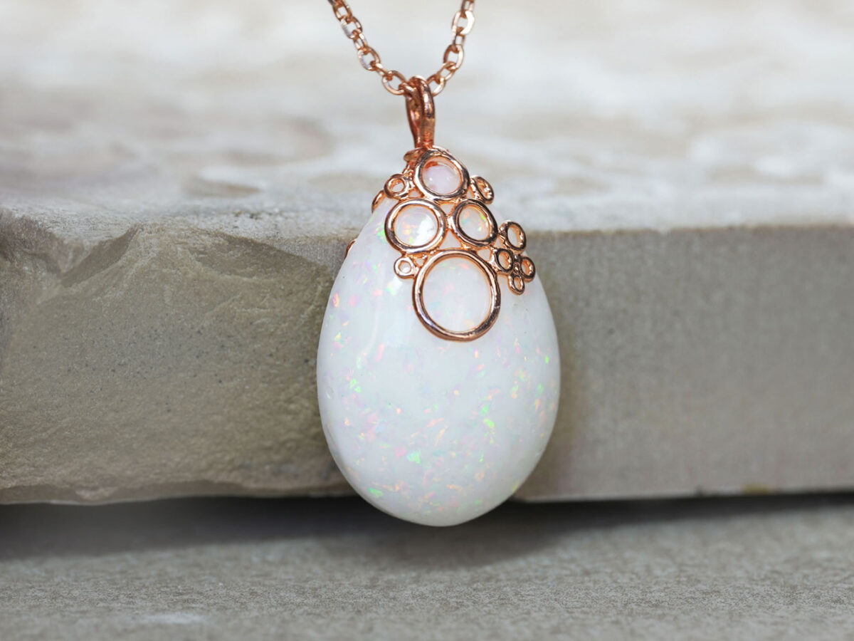 Breastmilk jewelry necklace pendant drop teardrop shape with opal real crushed gems and fancy rose gold bubbles bail from KeepsakeMom