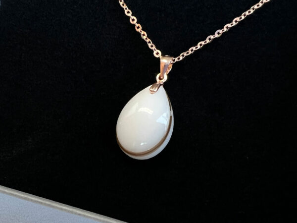 Breastmilk jewelry necklace pendant drop teardrop shape with lock of hair from KeepsakeMom