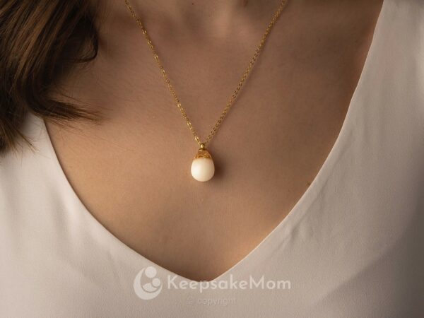 Breastmilk jewelry necklace teardrop gold flakes baby bottle from KeepsakeMom model
