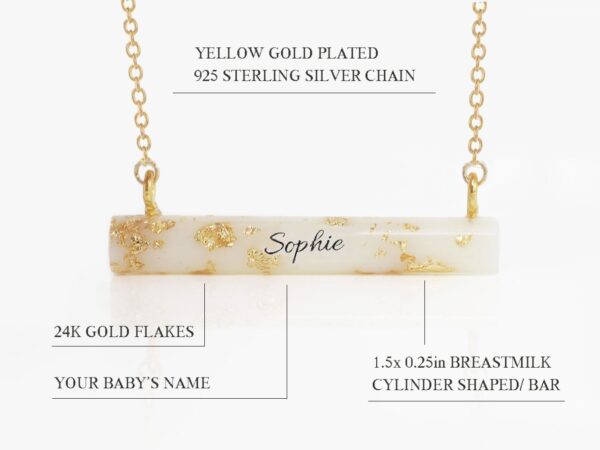 breast milk necklace pendant cylinder stick shape with yellow gold flakes throughout and name in the middle on white background feature describing diagram from keepsakemom