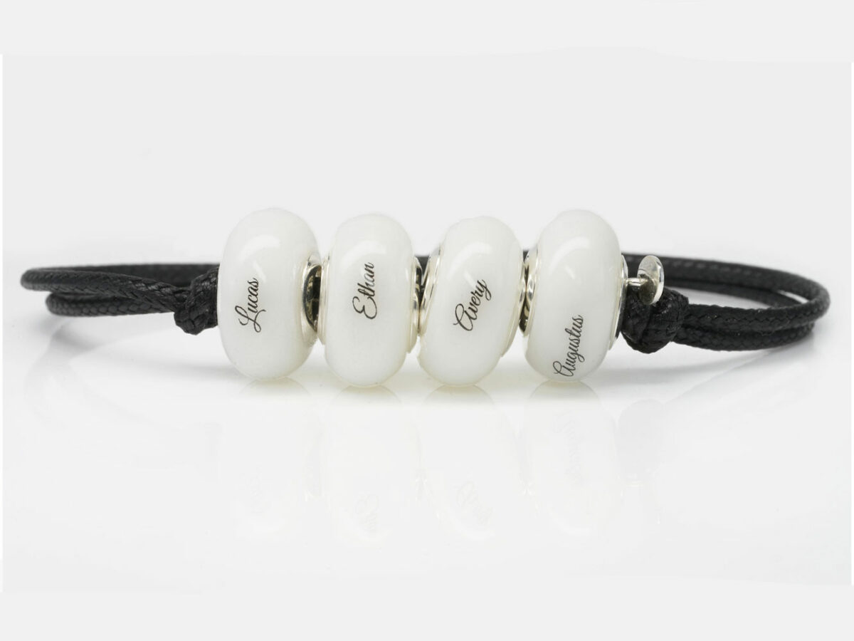 breast milk four bead bracelet with black cord with children's names on each bead from keepsakemom