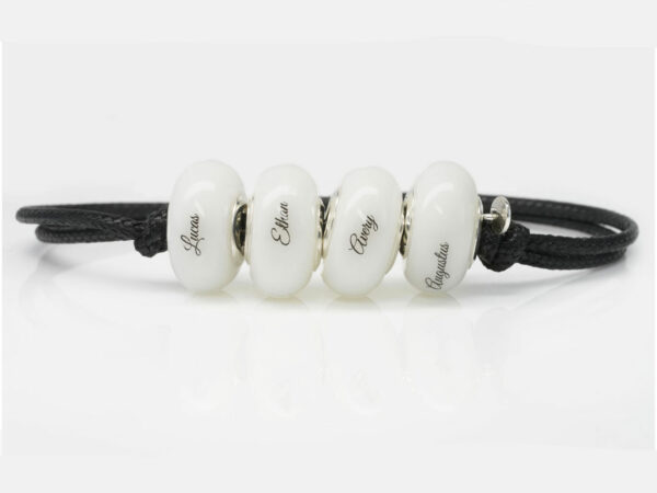 breast milk four bead bracelet with black cord with children's names on each bead from keepsakemom