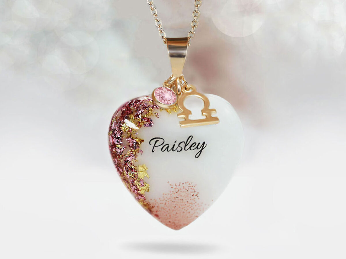breast milk jewelry heart necklace with yellow gold and baby girl pink flakes and baby's name and pink baby charm with zodiac charm from keepsakemom