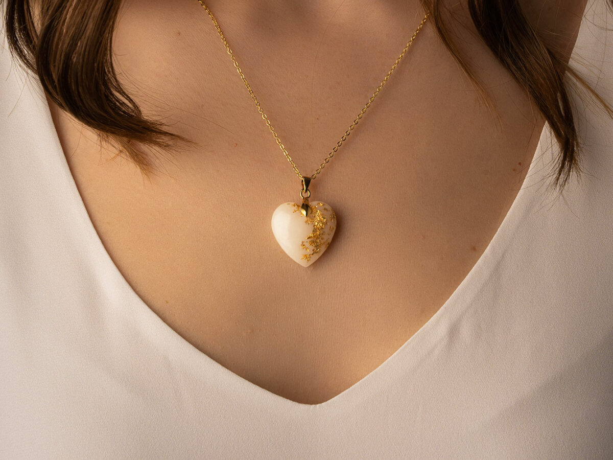 Breastmilk jewelry heart necklace with yellow gold flakes, chain and bail KeepsakeMom modeled