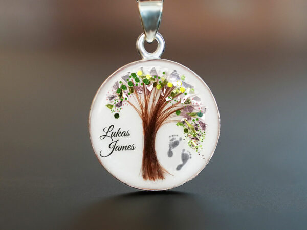 breastmilk jewelry disc necklace tree of life with baby's lock of hair and birth month color green august flakes tree and foot prints KeepsakeMom