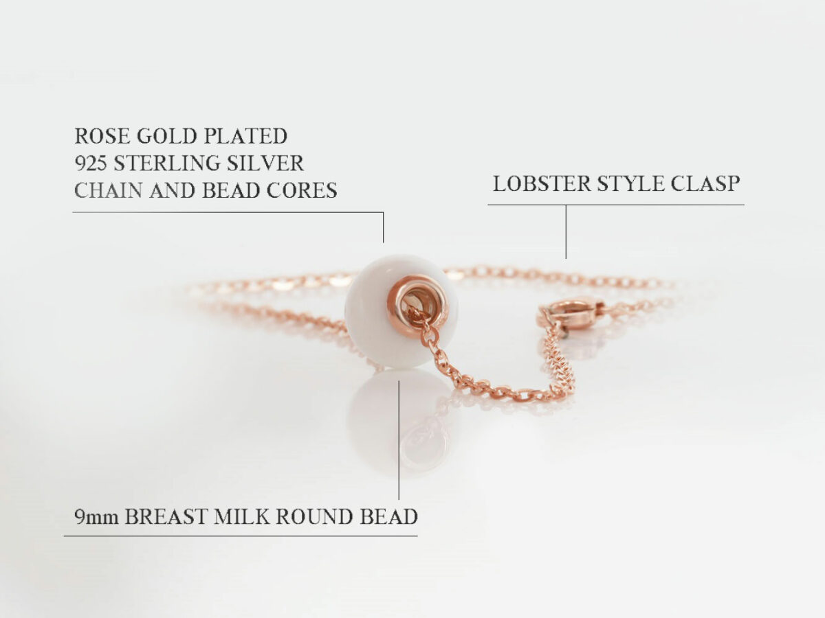 breast milk necklace with breast milk pearl bead with rose on white background describing features diagram from keepsakemom