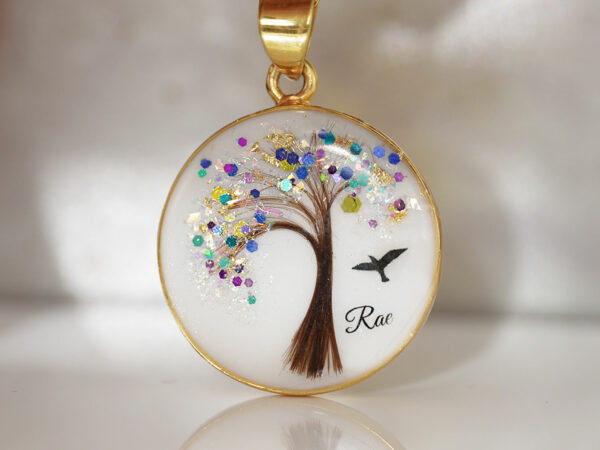 breastmilk jewelry disc necklace tree of life with baby's lock of hair and birth month color purple February flakes tree and bird KeepsakeMom