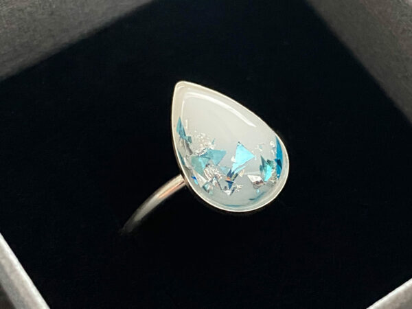 sterling silver teardrop ring with rope band, breast milk stone with light blue and opal flakes from KeepsakeMom