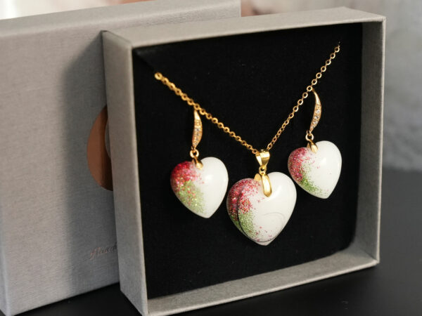breastmilk jewelry set hearts birth month color shimmer earrings and heart necklace with locks of hair from KeepsakeMom