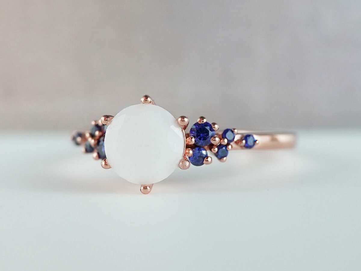 breastmilk jewelry silver ring diamond shaped milk stone and five gems on each side dark blue birth month colors from KeepsakeMom