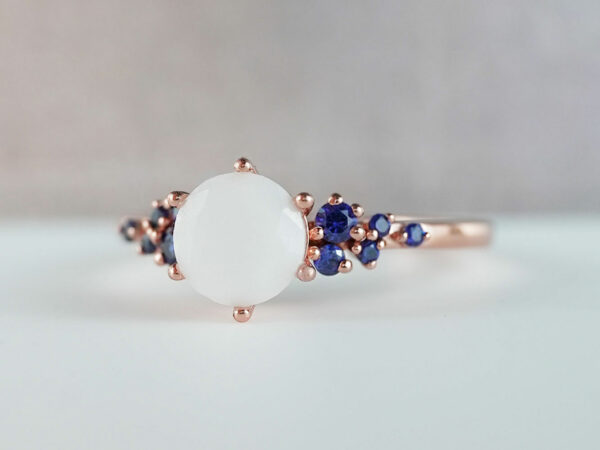 breastmilk jewelry silver ring diamond shaped milk stone and five gems on each side dark blue birth month colors from KeepsakeMom