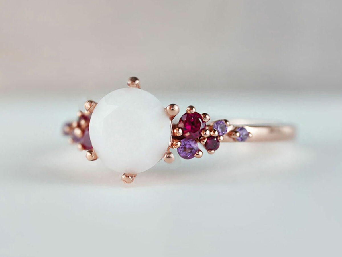 breastmilk jewelry silver ring diamond shaped milk stone and five gems on each side purple and red birth month colors from KeepsakeMom