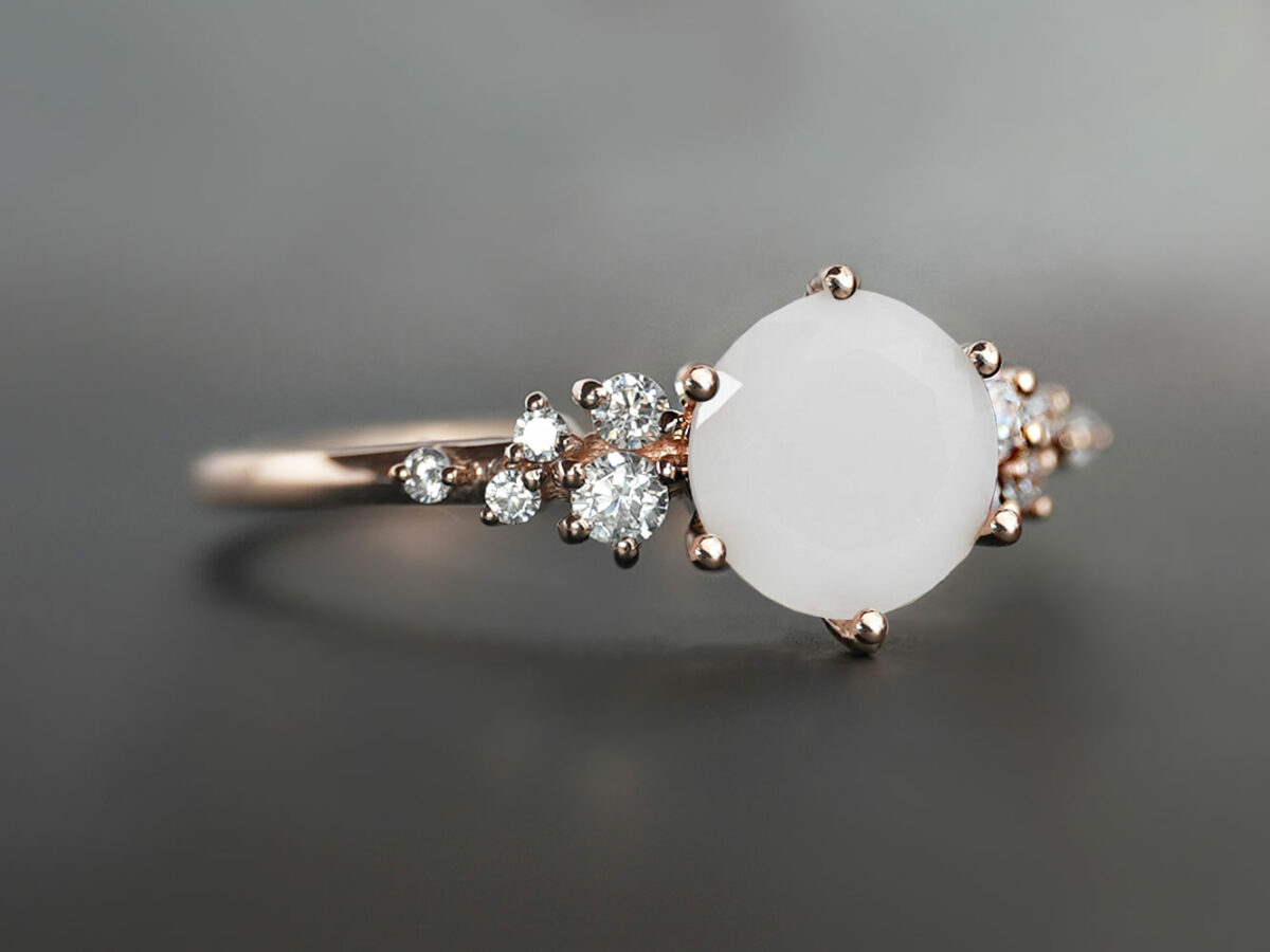 breastmilk jewelry silver ring oval milk stone and three gems in a leaf shapes on each side in various birth month colors from KeepsakeMom
