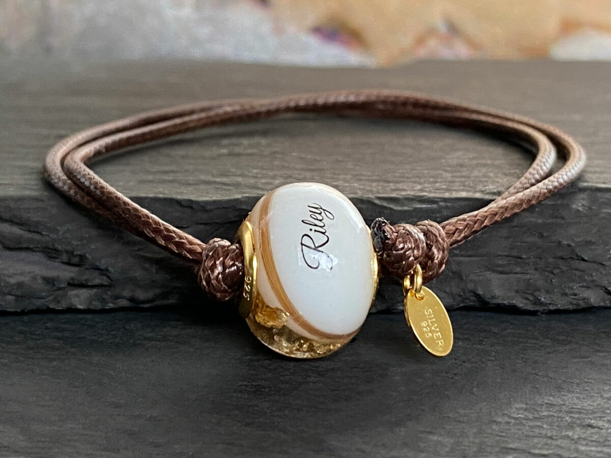 breastmilk jewelry bead bracelet with hair inclusions flakes yellow gold child's name and lock of hair keepsakemom