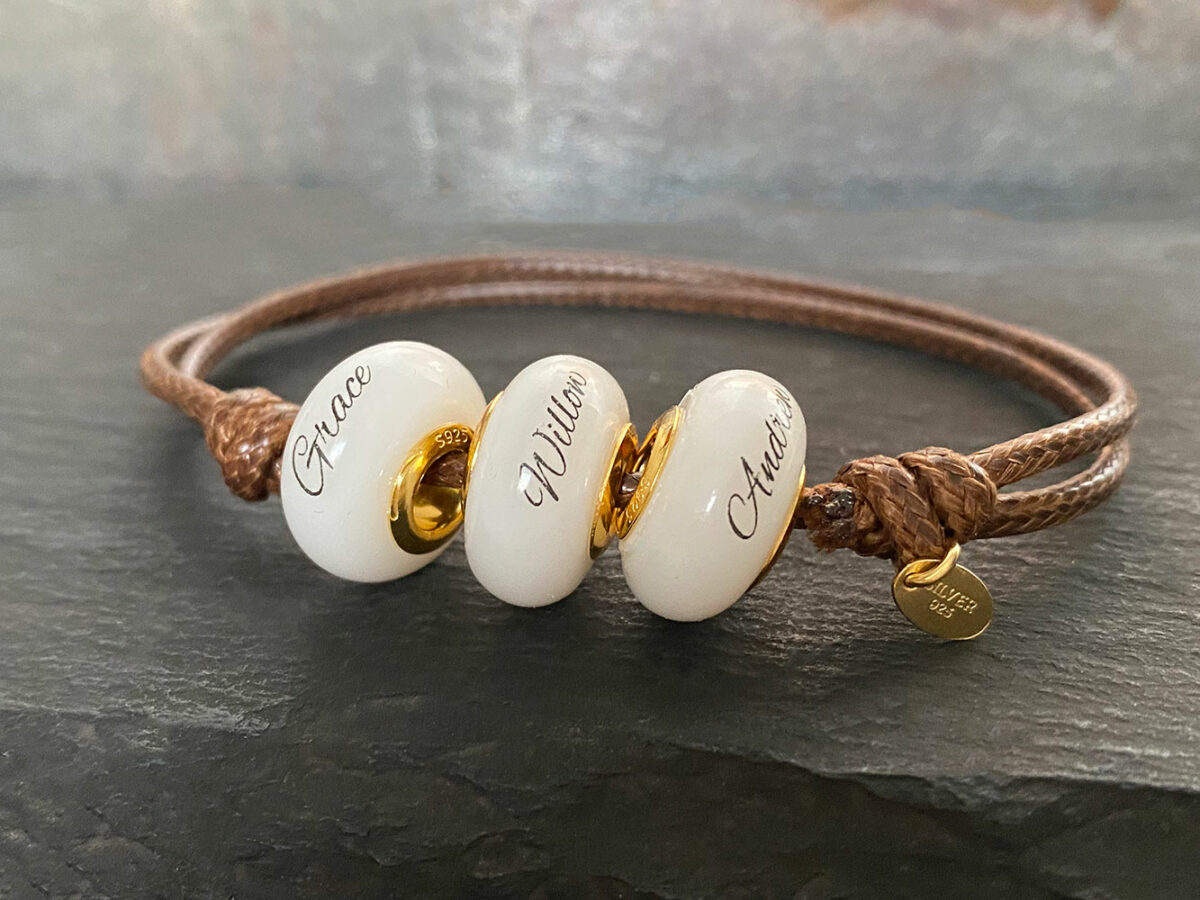 breastmilk jewelry bead bracelet with childs name birth date hair inclusion yellowgold keepsakemom