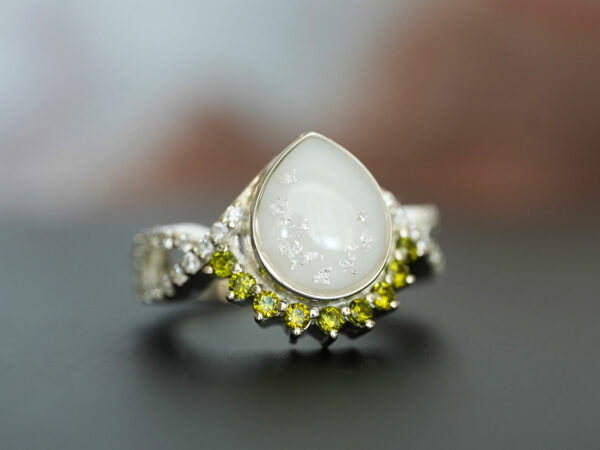breastmilk jewelry ring crystals teardrop birth month color crystals teardrop from KeepsakeMom sterling silver white gold peridot crystals