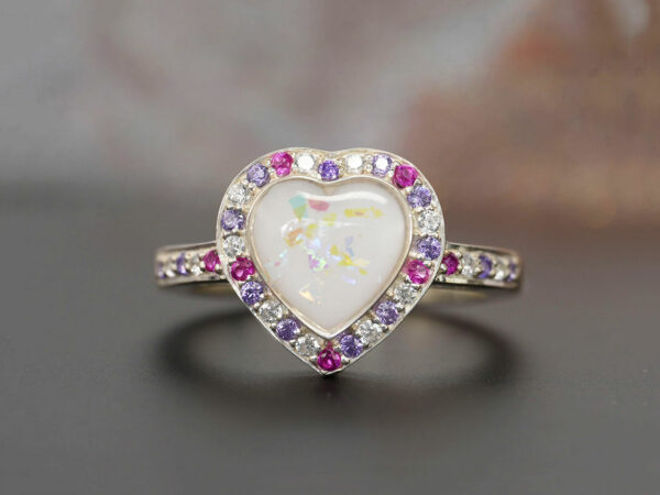 breastmilk ring heart with birth month crystals from KeepsakeMom with opal effect flakes