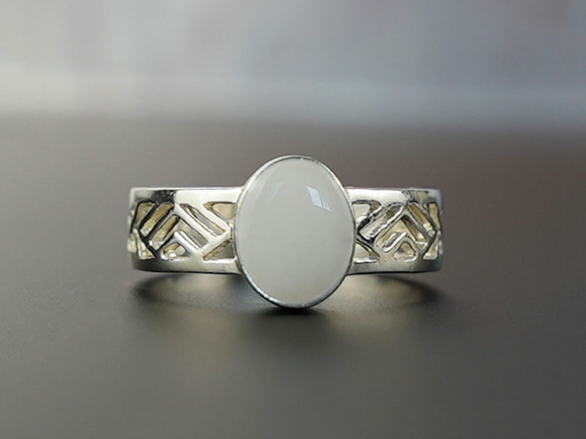 sterling silver with negatively spaced rectangular slits in a thick band with an oval shaped breast milk stone from KeepsakeMom