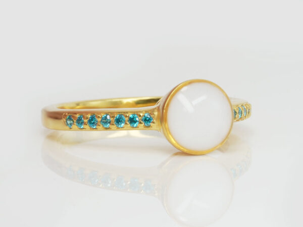 breastmilk ring in yellow gold with round breastmilk stone and side crystals blue from keepsakemom