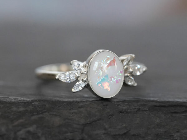 breastmilk ring burst of love oval with crystals from KeepsakeMom with opal effect flakes silver white gold