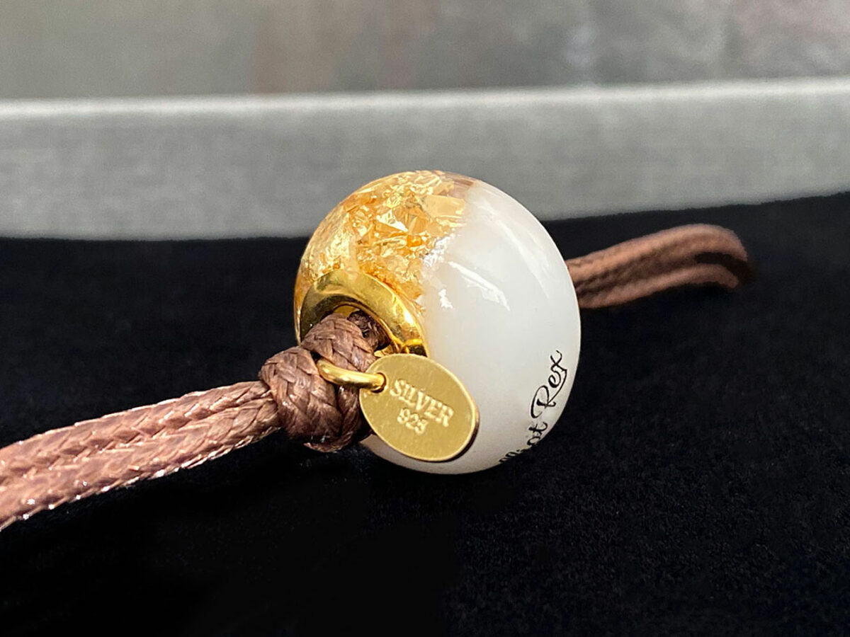 breastmilk jewelry bead bracelet with hair inclusions flakes yellow gold child's name and lock of hair keepsakemom