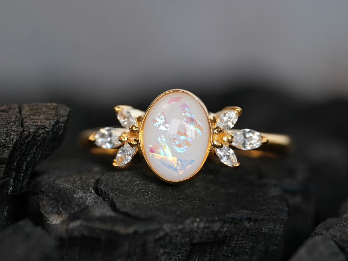 breastmilk ring burst of love oval with crystals from KeepsakeMom with opal effect flakes