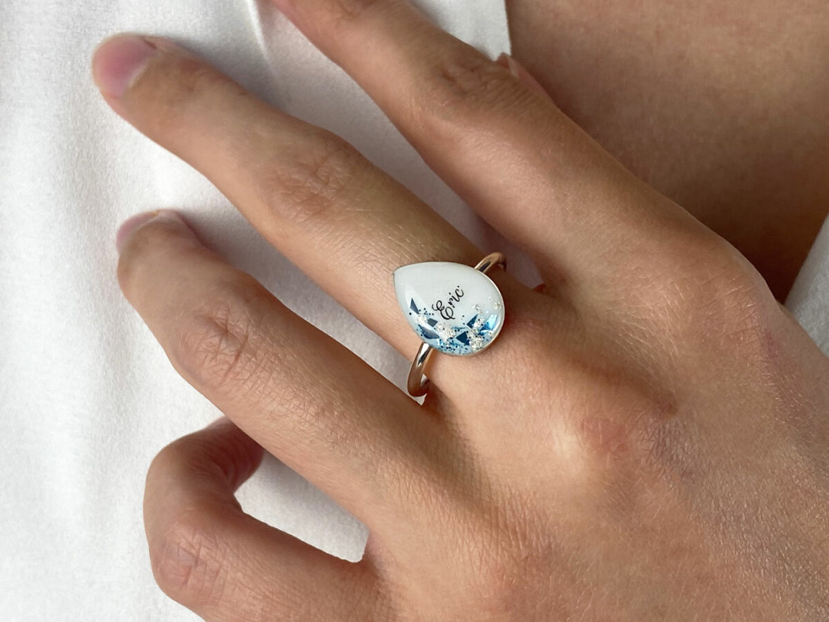 sterling silver teardrop ring with rope band, breast milk stone with blue flakes and name from KeepsakeMom