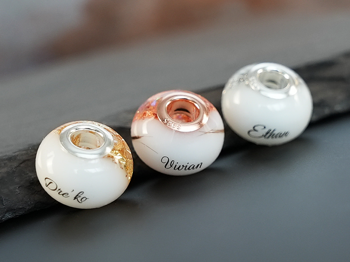 breastmilk jewelry bead with hair inclusion flakes silver yellowgold rosegold childs name birth date keepsakemom