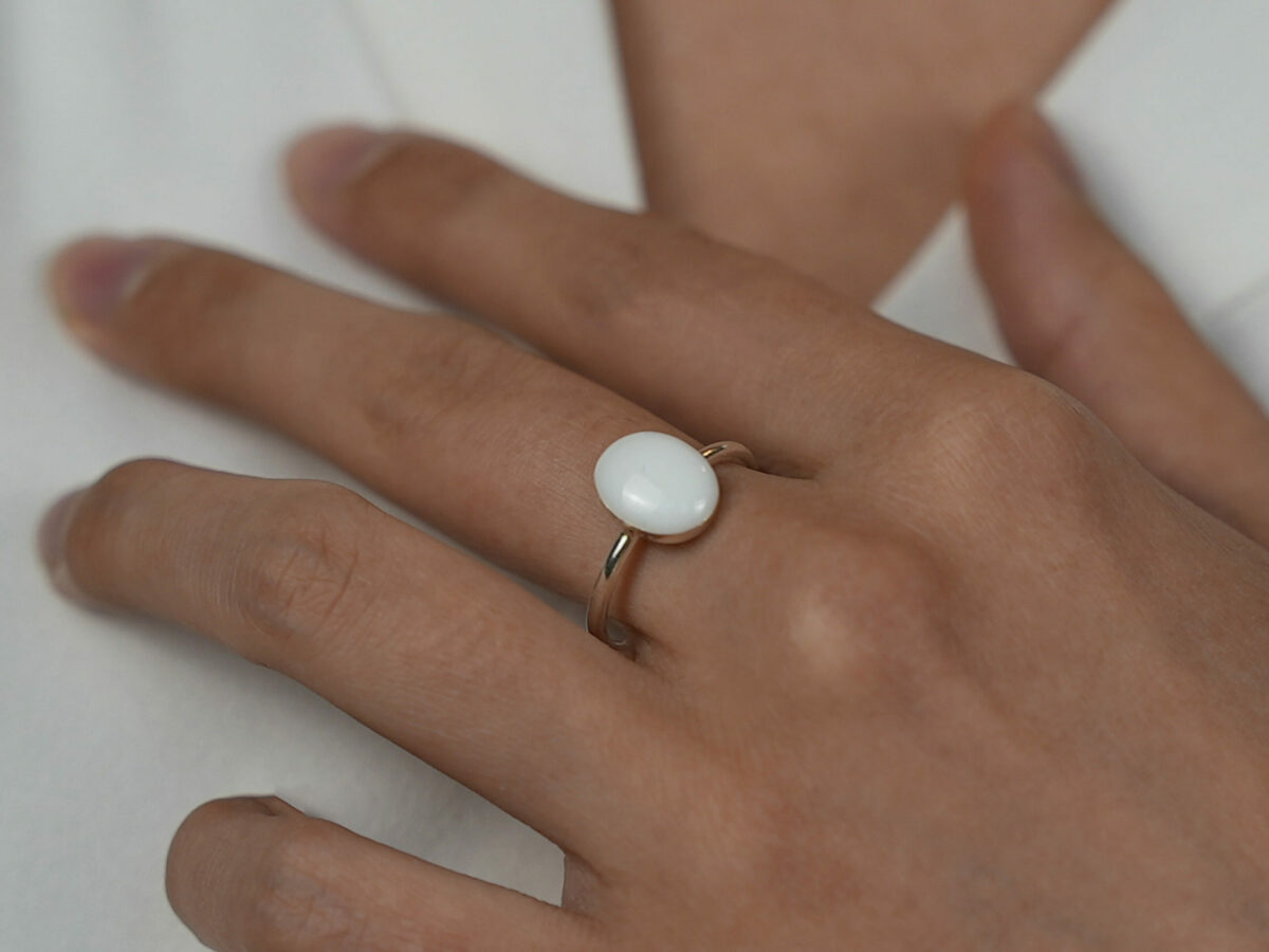 breastmilk jewelry rose gold plated sterling silver oval-shaped breast milk ring from KeepsakeMom on a model hand