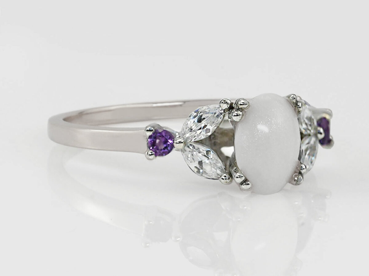 breastmilk jewelry ring oval milk stone and three gems in a leaf shapes on each side in various birth month colors from KeepsakeMom