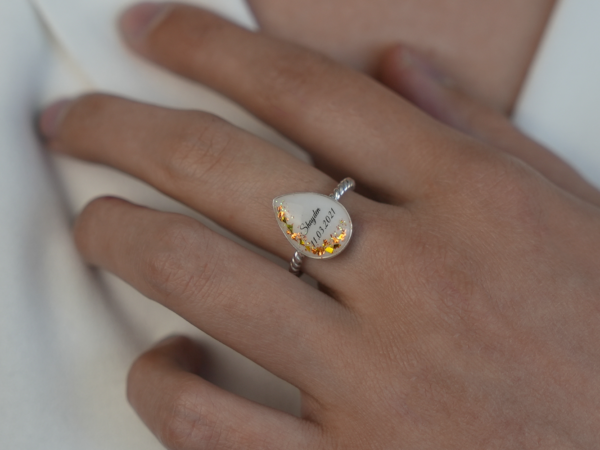 sterling silver teardrop ring with rope band, breast milk stone with orange opal flakes, name and date from KeepsakeMom