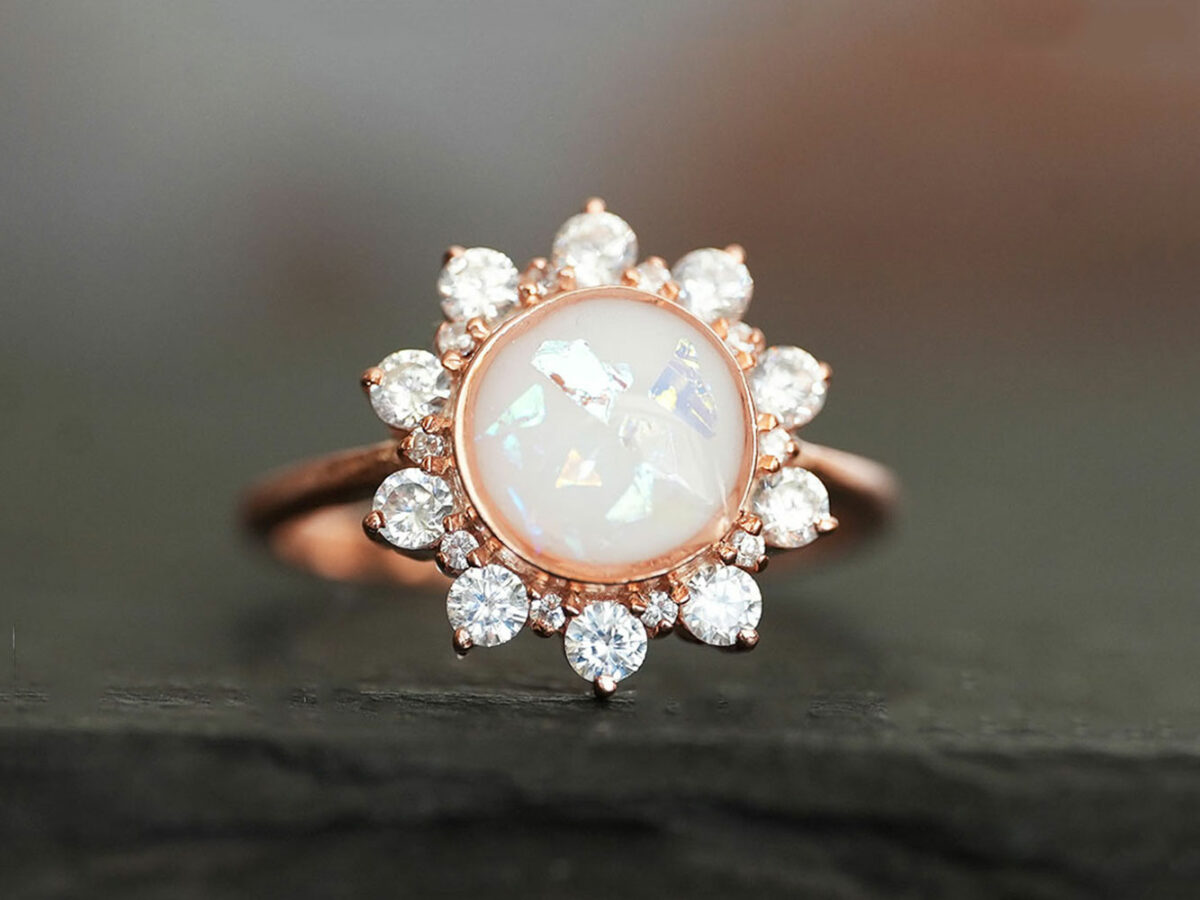 rose gold plated sterling silver sunflower-looking ring with diamond crystals with round-shaped breast milk stone in opal flakes from KeepsakeMom