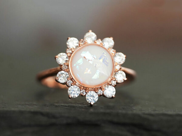 rose gold plated sterling silver sunflower-looking ring with diamond crystals with round-shaped breast milk stone in opal flakes from KeepsakeMom