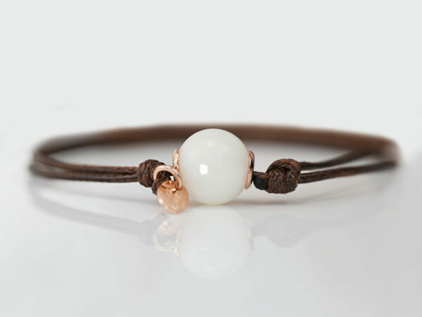 breastmilk one simple pearl made with breastmilk on a brown cord with rose gold tag on white background from keepsakemom