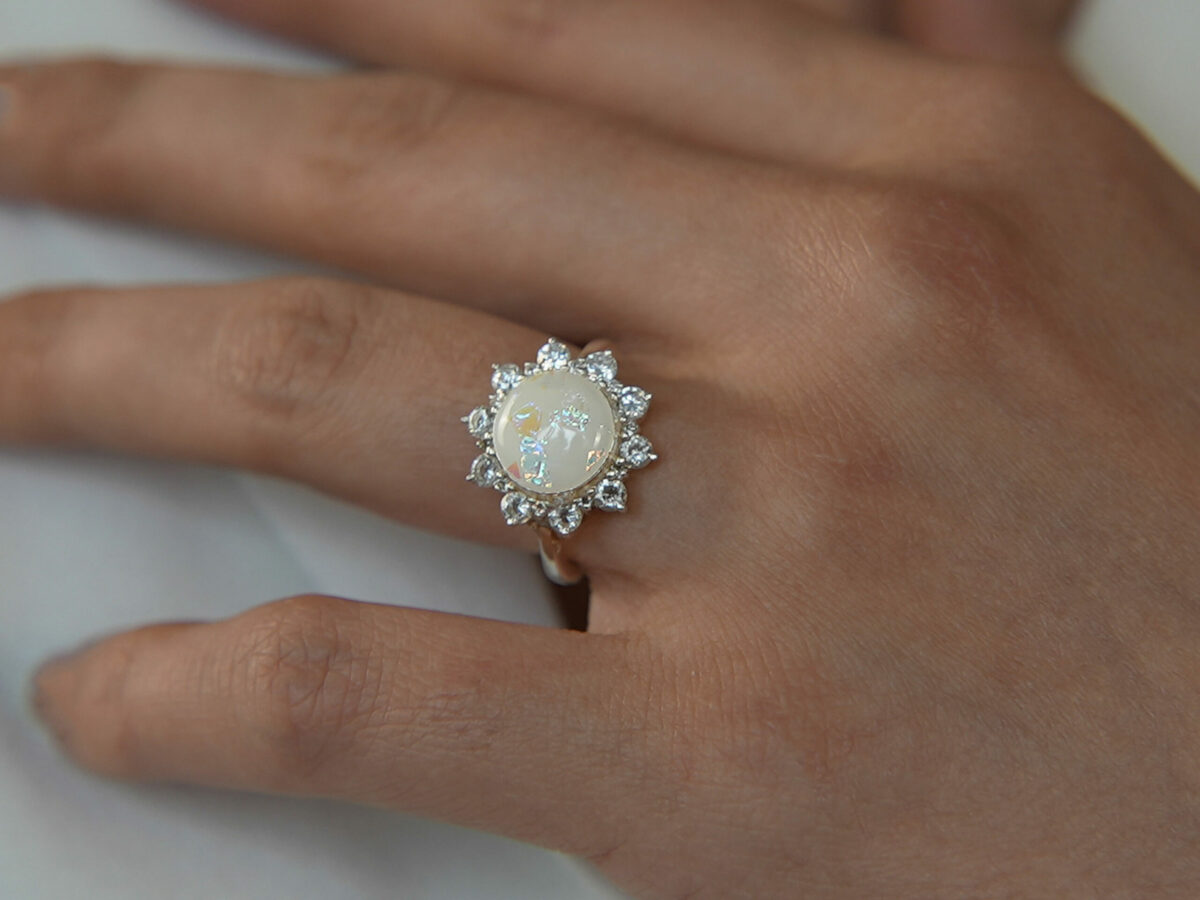 breastmilk jewelry ring flower with crystals white gold KeepsakeMom opal hand model