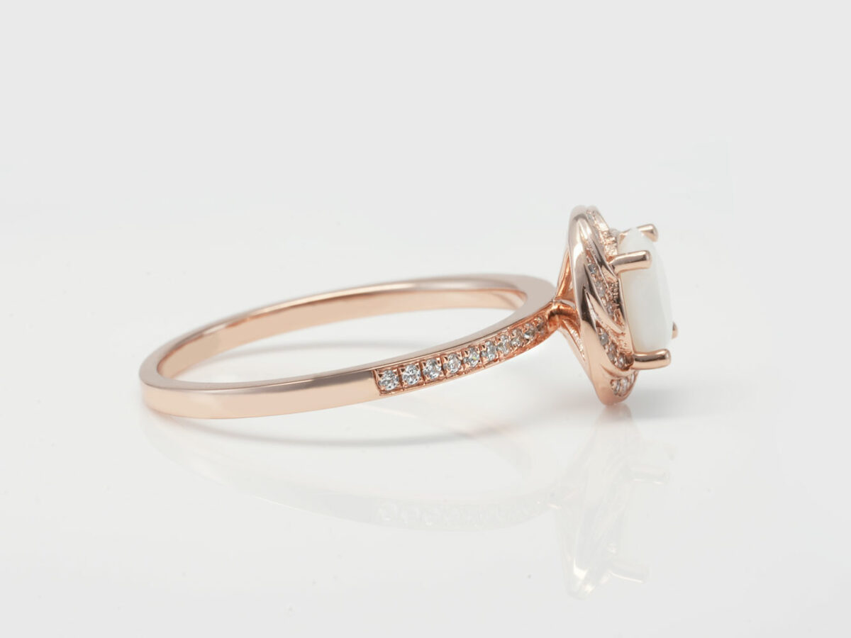 breast milk ring rose gold side view on white background with halo crystals around milk stone from KeepsakeMom