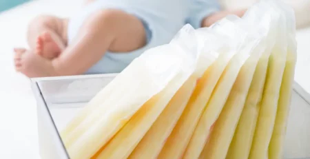Bags of frozen breast milk in a container