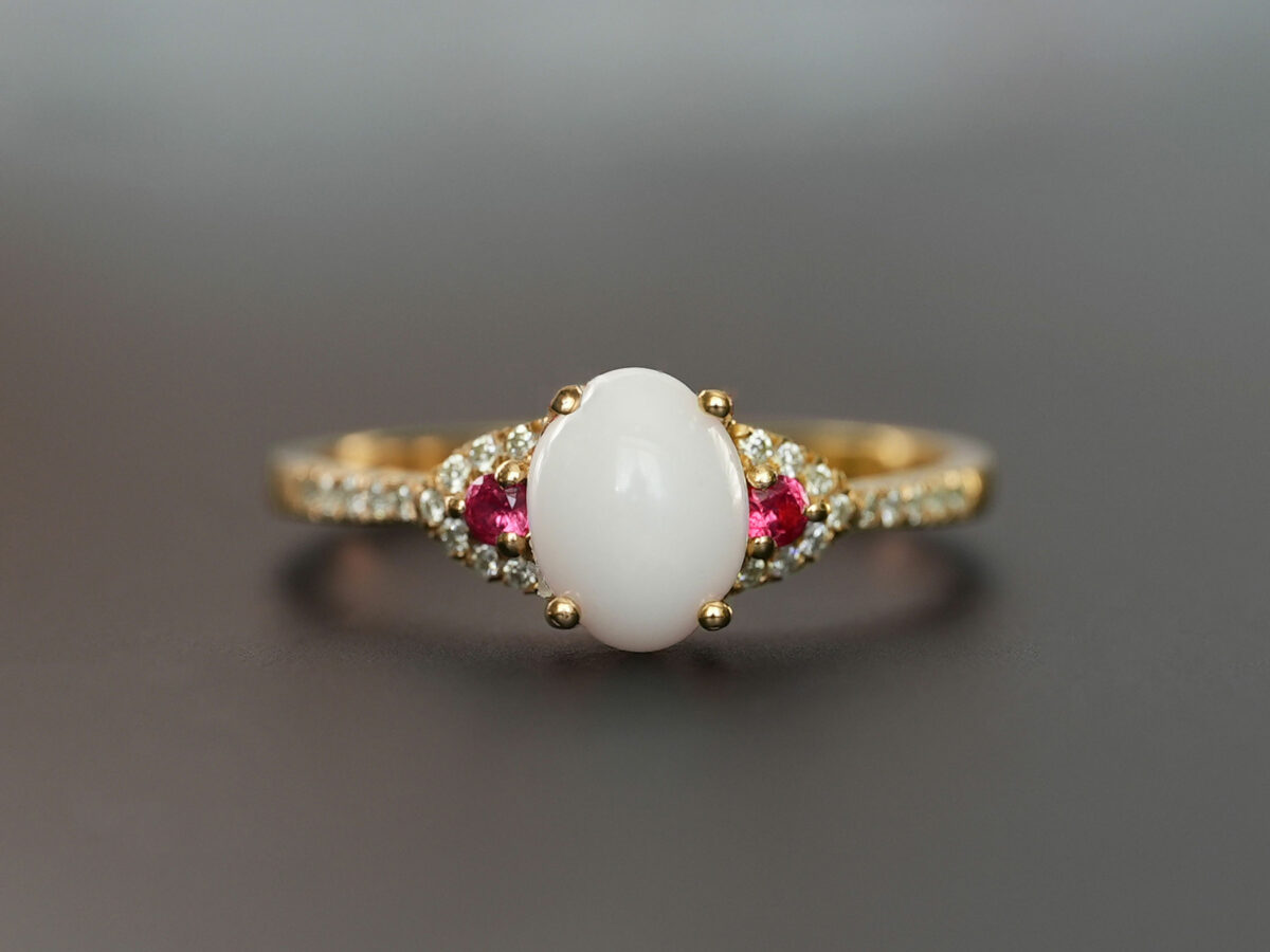 breastmilk jewelry fine ring with birth month color gems and oval breastmilk stone KeepsakeMom gold red ruby