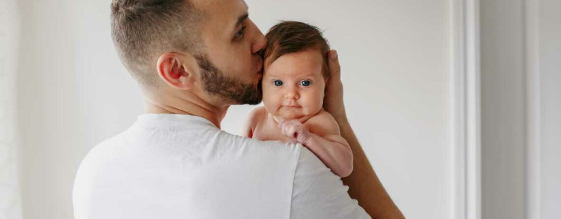 Father holding newborn baby