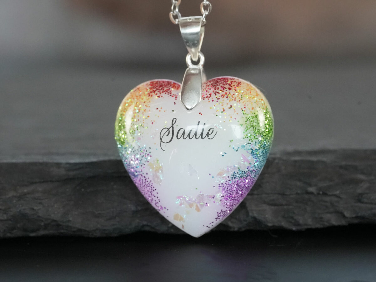 Breastmilk Jewelry heart necklace with rainbow shimmers and name with silver chain and bail from KeepsakeMom