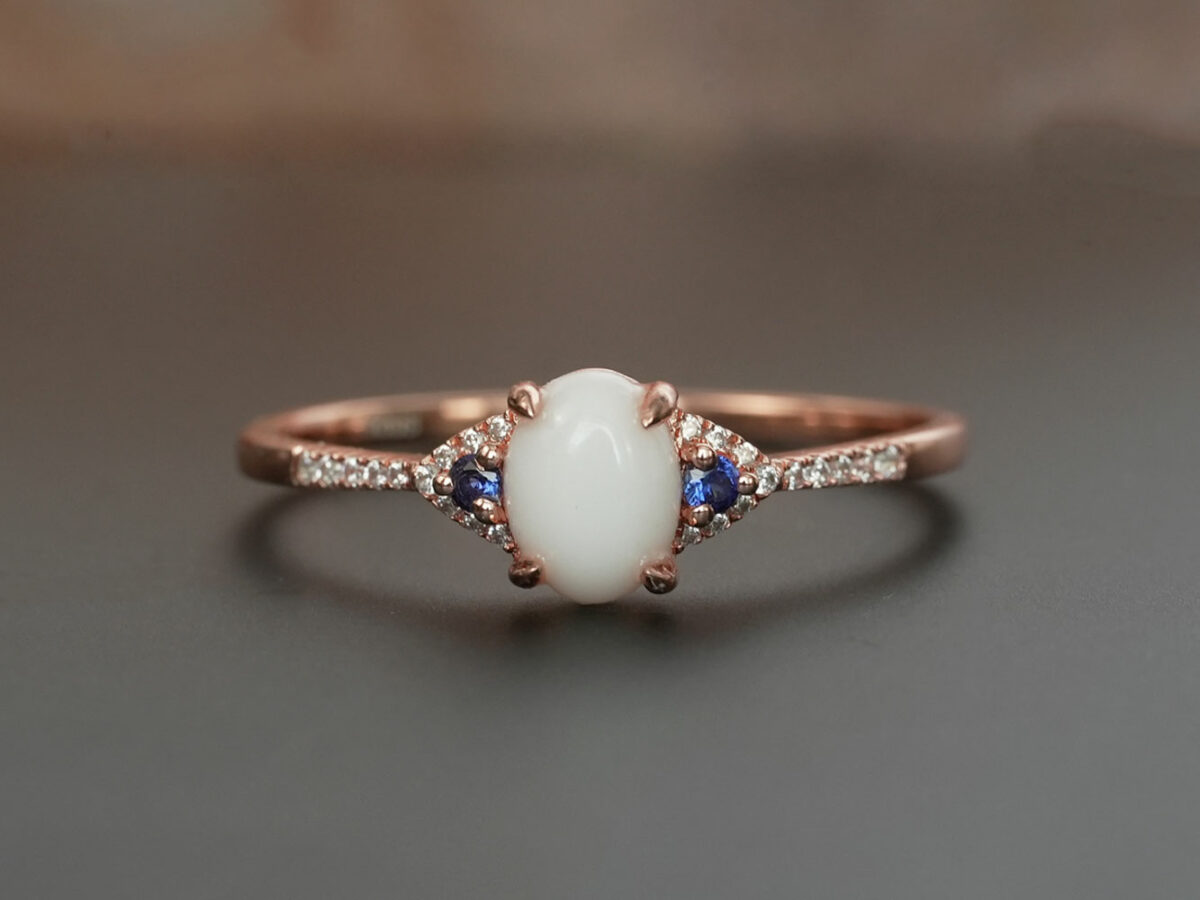 breastmilk jewelry fine ring with birth month color gems and oval breastmilk stone KeepsakeMom white gold blue sapphire