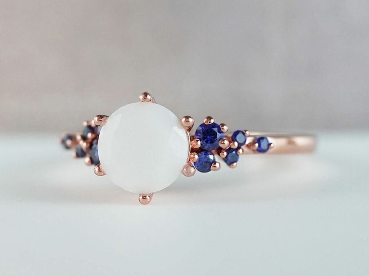 breastmilk jewelry silver ring diamond shaped milk stone and five gems on each side blue birth month colors from KeepsakeMom