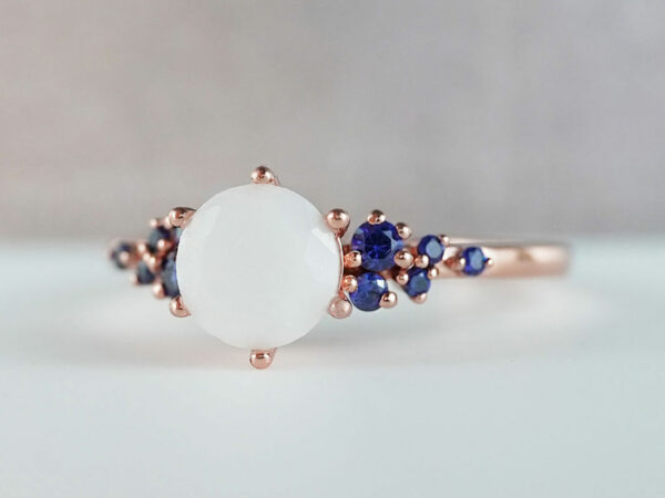 breastmilk jewelry silver ring diamond shaped milk stone and five gems on each side blue birth month colors from KeepsakeMom