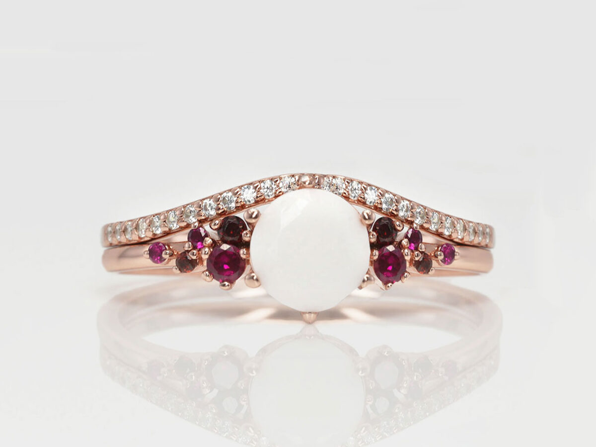 breastmilk jewelry silver ring set diamond shaped milk stone and five purple birth month color gems from KeepsakeMom and top add-on ring in a wave shape in rose gold plating