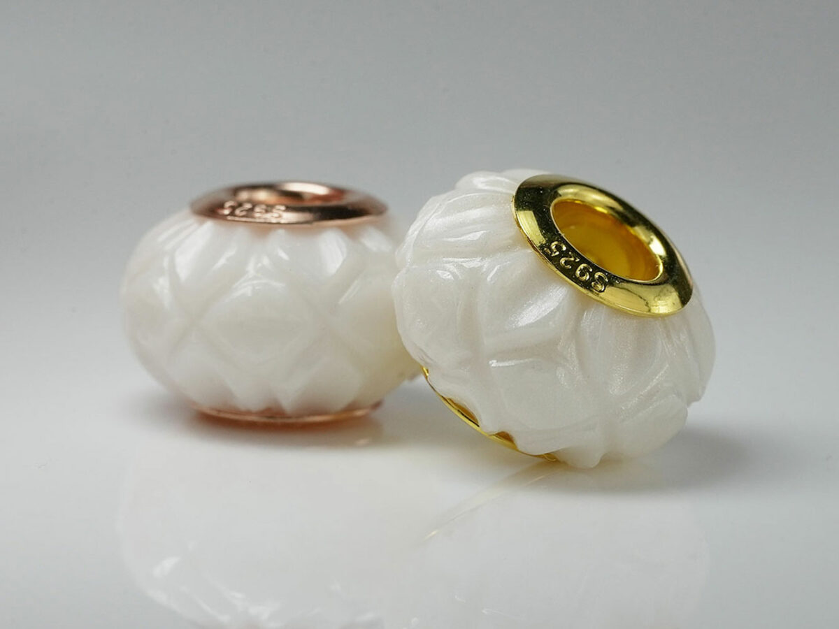 breastmilk jewelry flower bead with yellow gold and rose gold bead cores from keepsakemom